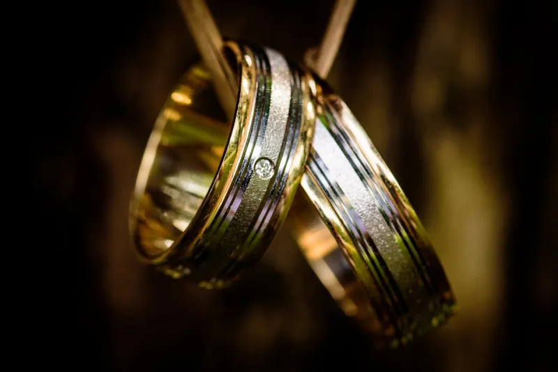 Platinum and gold wedding ring pair